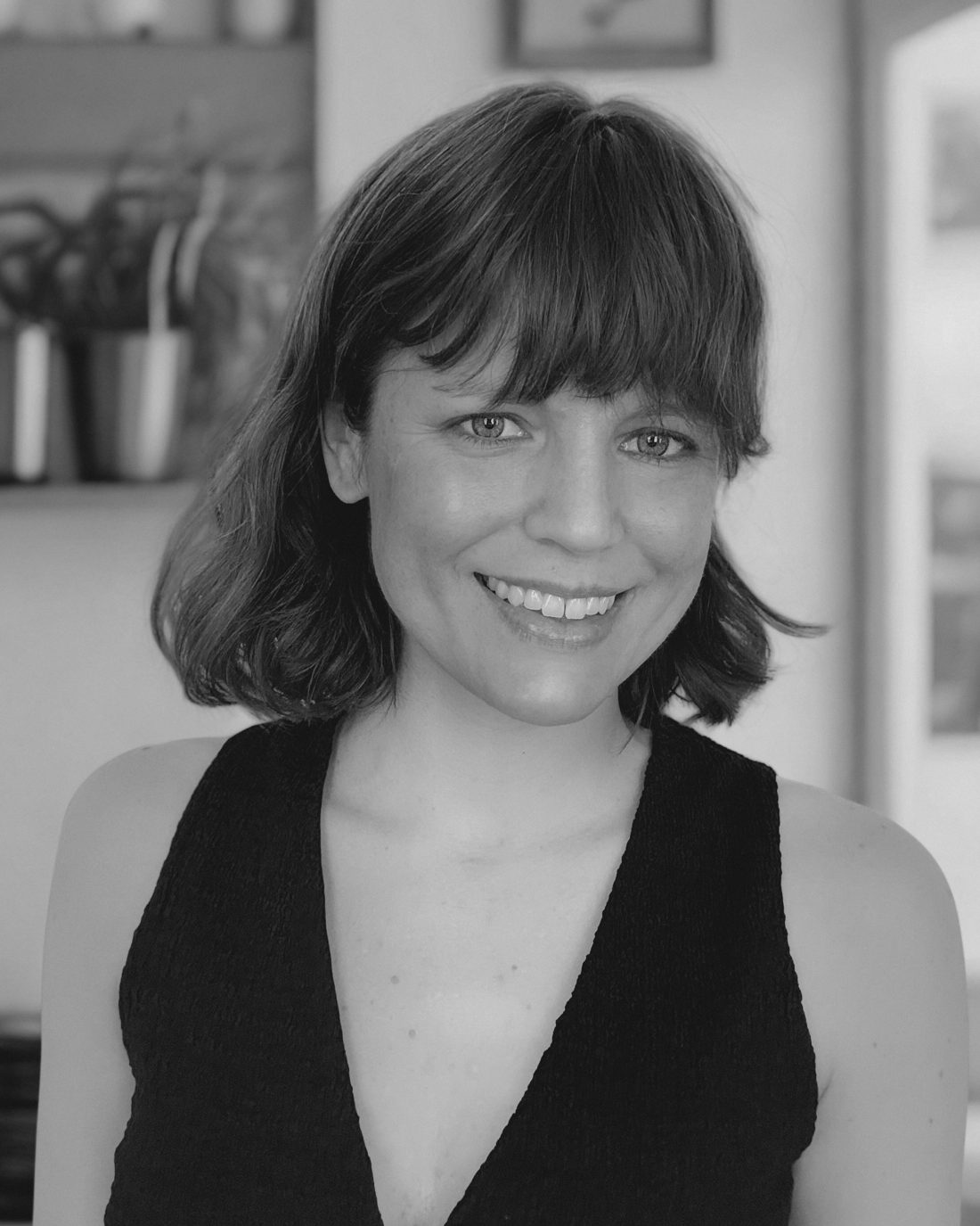Jane Riccobono, smiling, in black and white